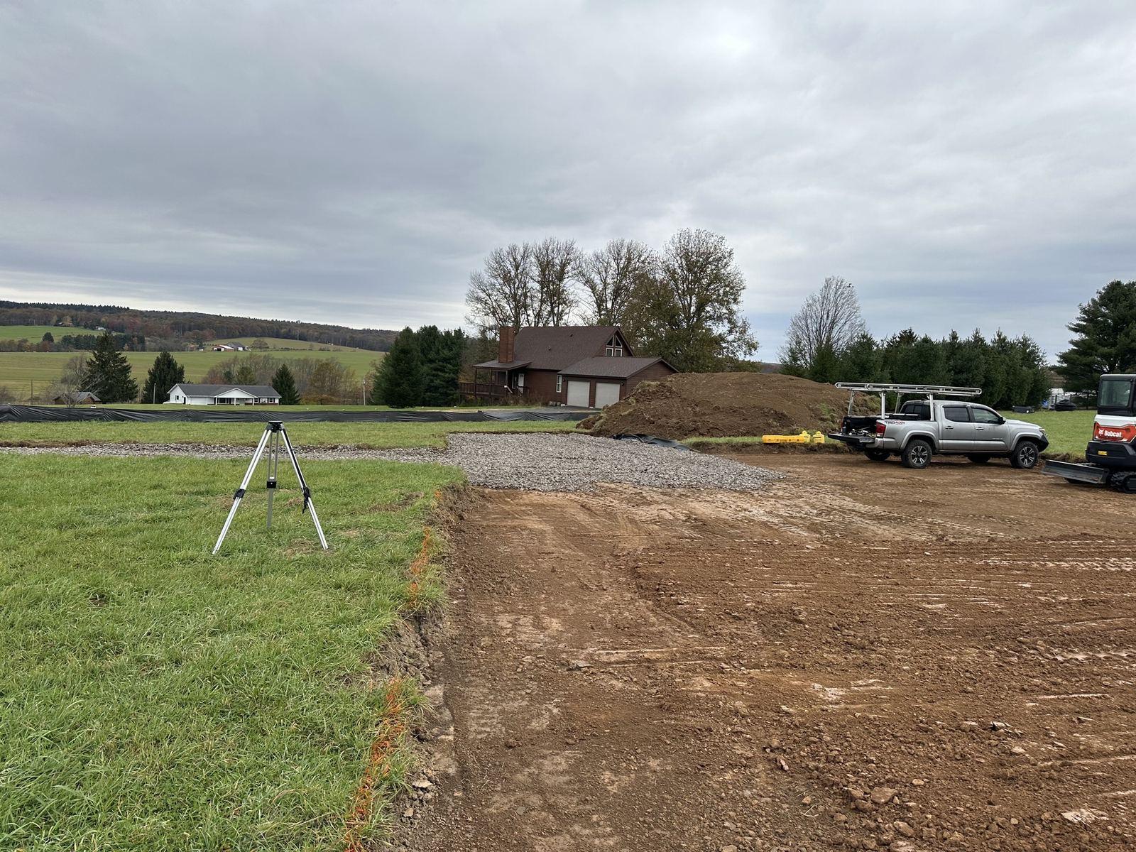 Driveway subgrade cut, with a laser set up.