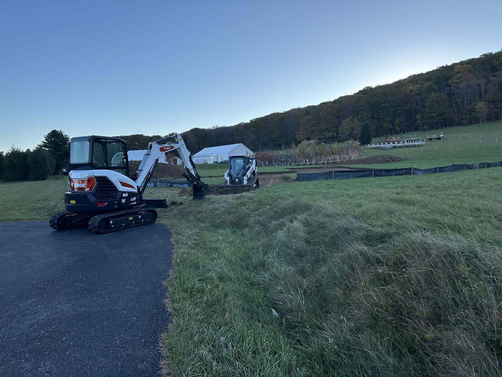 The Bobcat E35 on the driveway at Green Meadow in late light.