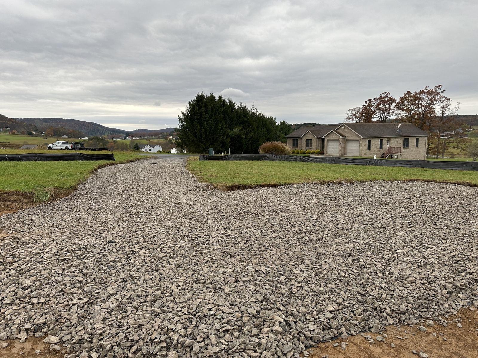 A finished stone driveway leading to the house at Green Meadow.