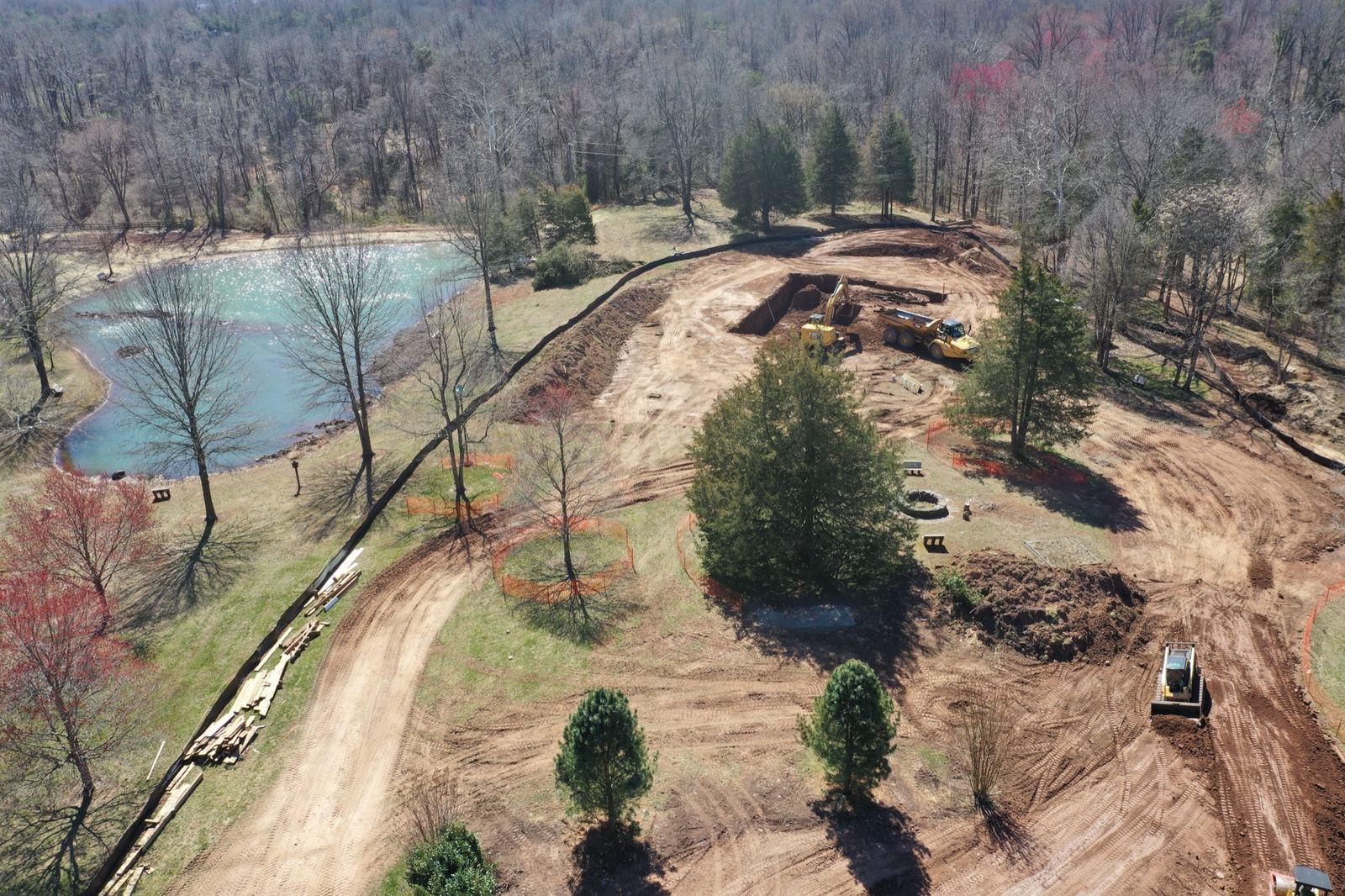 Graded pads and haul roads beside a pond at the Haymarket project.