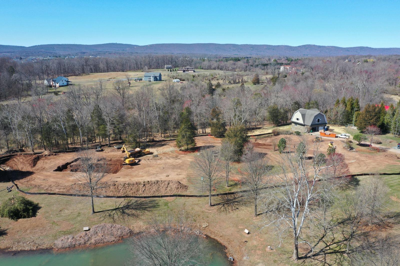 Graded home sites, a pond, and the Blue Ridge horizon at Haymarket.