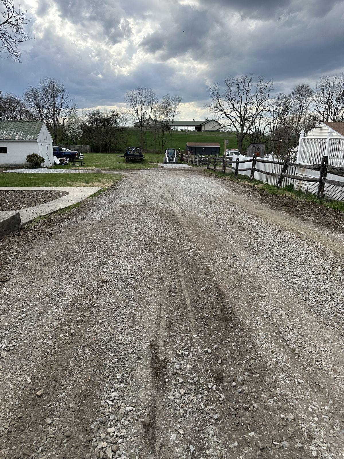 The long regraded gravel driveway at Mapleville.