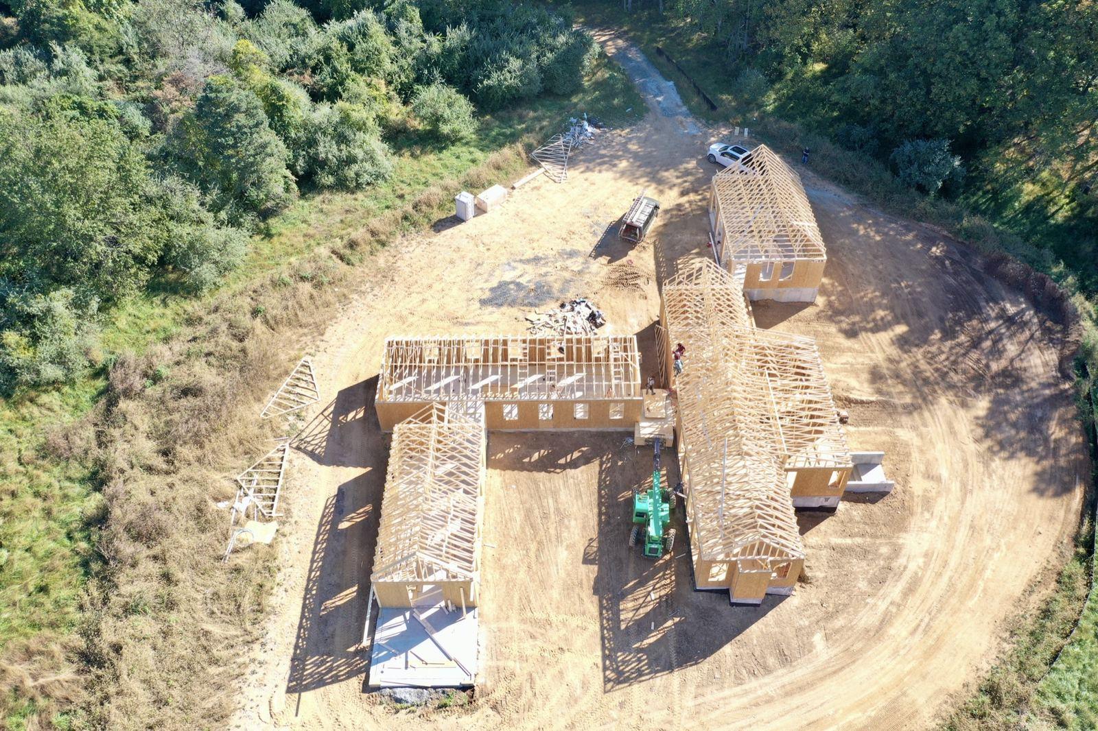 The framed house on its graded pad in Purcellville, from the air.