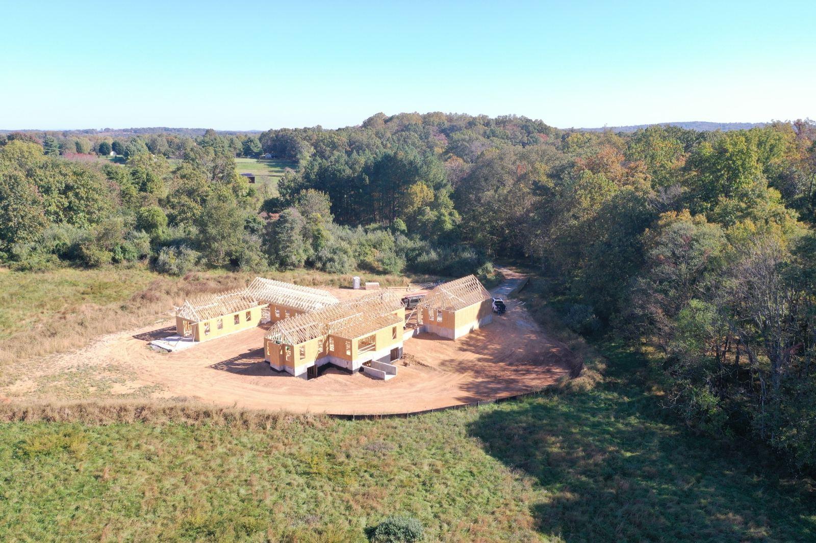 A graded pad cut into a wooded lot in Purcellville.