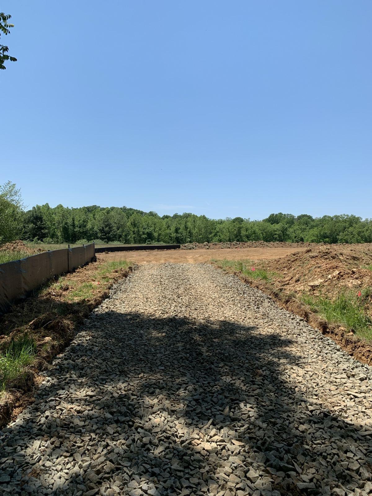 A stone driveway along the tree line in Purcellville.