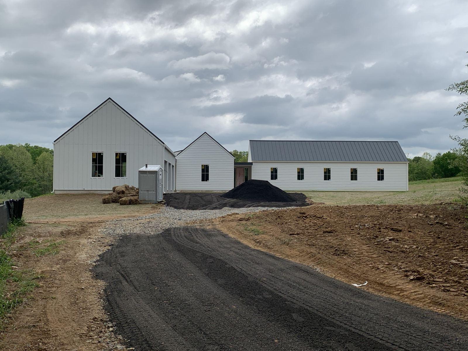 A new asphalt driveway to the farmhouses at the Purcellville project.