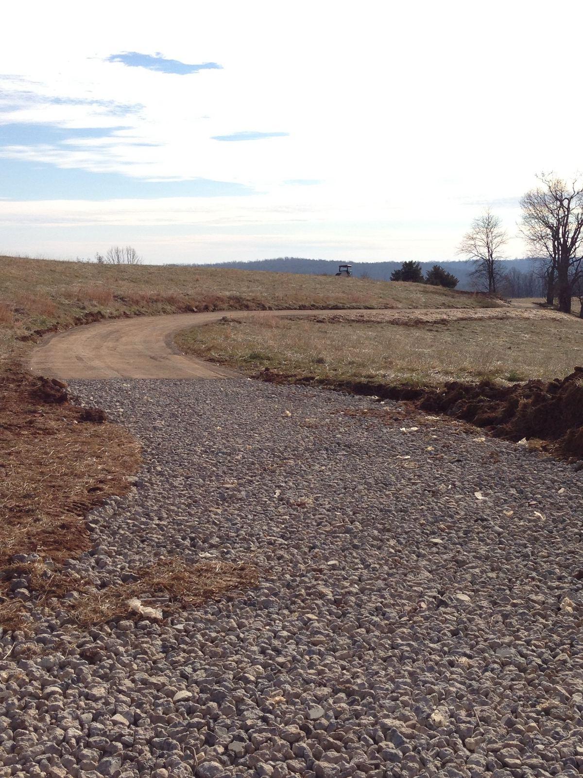 A curving stone driveway across open ground at Wildcat.