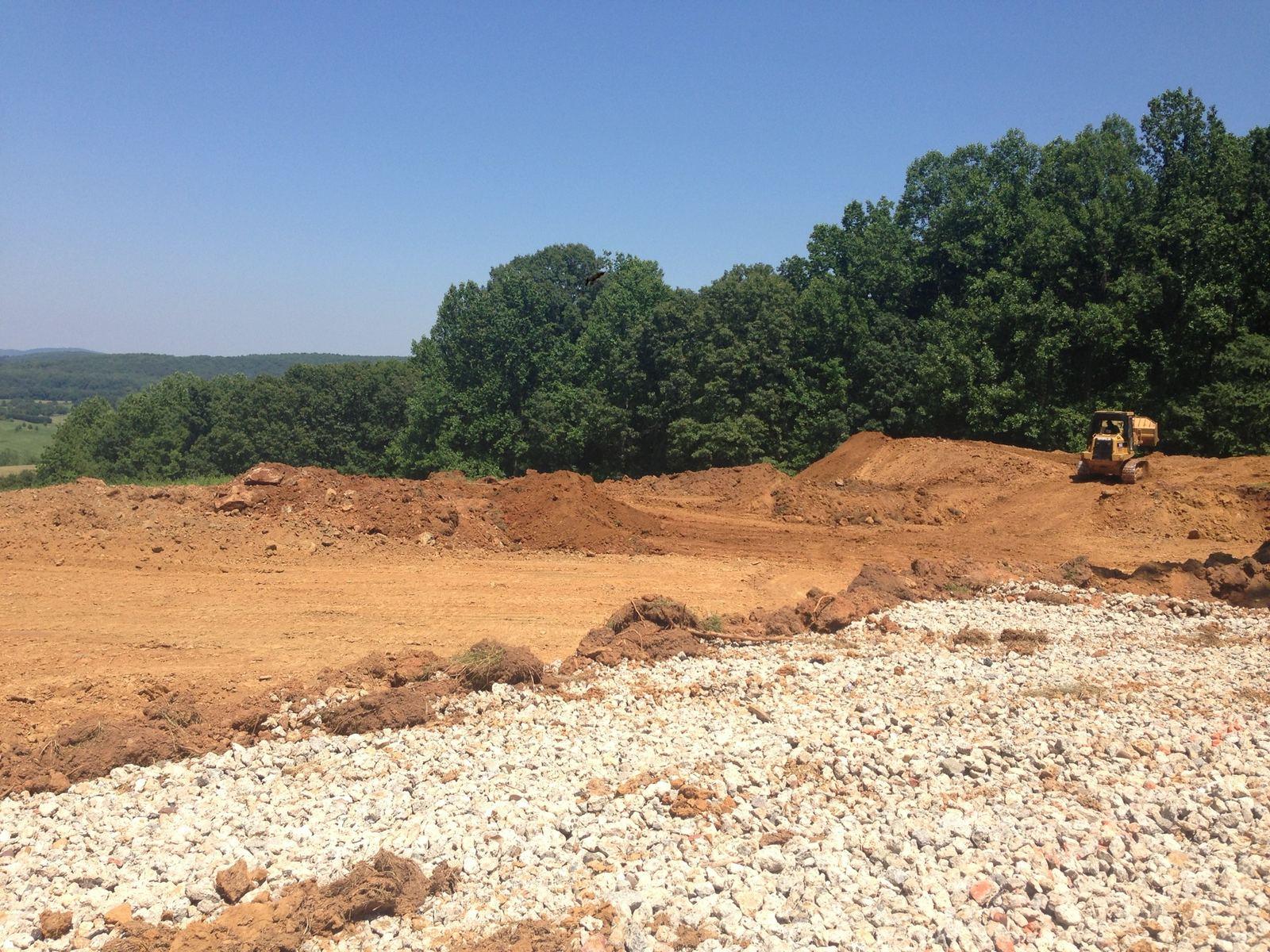 A cleared hillside at Wildcat, with a machine at the tree line.